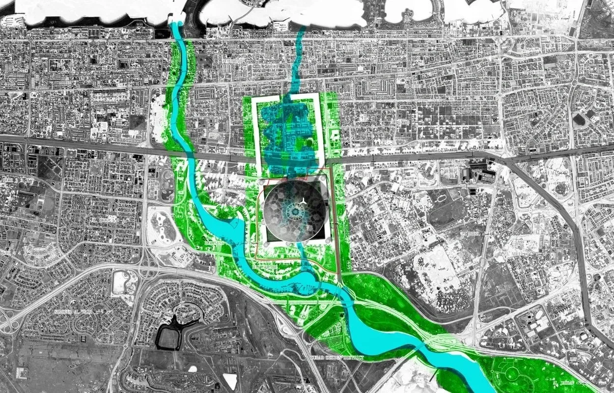Black and white satellite map with a color overlay highlighting a central circular development zone. The plan features blue water systems and green ecological corridors weaving through the site, with a red boundary marking the main intervention area.